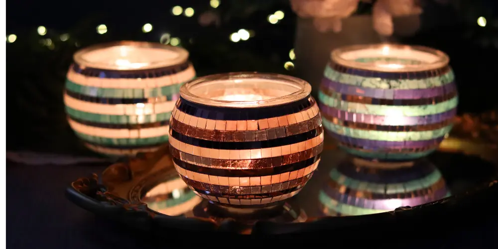 Elegant glass candle holder, a perfect housewarming gift, adding warmth and charm to any room.